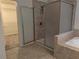Luxurious main bathroom featuring a glass shower and walk in closet at 19314 Long Lake Ranch Blvd, Lutz, FL 33558