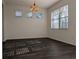 Elegant dining room with luxury floors and ample natural light at 19314 Long Lake Ranch Blvd, Lutz, FL 33558