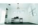 Bright dining room with modern lighting, dark floors, and large windows at 19314 Long Lake Ranch Blvd, Lutz, FL 33558