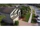 Beautiful two-story home with a brick driveway, lush landscaping, and a neutral color palette at 19314 Long Lake Ranch Blvd, Lutz, FL 33558