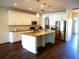 Bright and spacious kitchen with stainless steel appliances, a large island, and ample cabinet space at 19314 Long Lake Ranch Blvd, Lutz, FL 33558