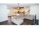 Open-concept living room flows seamlessly into a kitchen with a large island, creating a perfect space for entertaining at 19314 Long Lake Ranch Blvd, Lutz, FL 33558