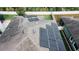 Aerial view of roof featuring solar panels, vents, and shingles at 19314 Long Lake Ranch Blvd, Lutz, FL 33558