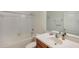 Bright bathroom featuring a tiled shower-tub combination and single vanity at 2218 Valterra Vista Way, Valrico, FL 33594