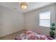 Bedroom featuring a window, and a ceiling light fixture at 2218 Valterra Vista Way, Valrico, FL 33594