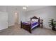 Bedroom featuring tile floors, overhead lighting, and neutral wall color at 2218 Valterra Vista Way, Valrico, FL 33594