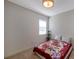 This bedroom features tile flooring and a decorative ceiling light at 2218 Valterra Vista Way, Valrico, FL 33594