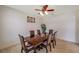 Bright dining room showcasing a traditional table set and an elegant ceiling fan at 2218 Valterra Vista Way, Valrico, FL 33594