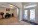 Inviting home foyer showcasing decorative double doors and an arched transom window at 2218 Valterra Vista Way, Valrico, FL 33594