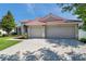 Beautiful single-Gathering home with attached two-car garage, a red tile roof, and a lush, green lawn at 2218 Valterra Vista Way, Valrico, FL 33594