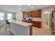 Charming kitchen featuring wood cabinetry, stainless appliances, and breakfast bar at 2218 Valterra Vista Way, Valrico, FL 33594