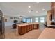 Bright kitchen with stainless appliances flows into the spacious living room at 2218 Valterra Vista Way, Valrico, FL 33594