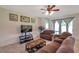 Cozy living room with a flat screen television and access to the outside at 2218 Valterra Vista Way, Valrico, FL 33594
