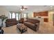 Comfortable living room with a ceiling fan, open to kitchen, and ample seating for relaxation at 2218 Valterra Vista Way, Valrico, FL 33594