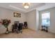 A well lit home office space featuring a desk, chairs, and bright sunlight at 2218 Valterra Vista Way, Valrico, FL 33594
