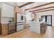 Bright modern kitchen featuring stainless steel appliances, white countertops, and custom cabinetry at 2429 1St N Ave, St Petersburg, FL 33713