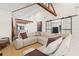 Spacious living room featuring exposed beams, fireplace, and hardwood flooring at 2429 1St N Ave, St Petersburg, FL 33713