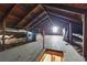 Spacious attic featuring wooden floors and a high, exposed-beam ceiling, offering potential for storage or conversion at 2710 8Th N Ave, St Petersburg, FL 33713