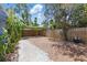 Fenced in backyard featuring trees and a pergola, ideal for outdoor living and entertaining at 2710 8Th N Ave, St Petersburg, FL 33713