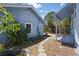 Backyard featuring a pond and stone pavers leading to a covered area at 2710 8Th N Ave, St Petersburg, FL 33713