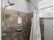 This bathroom features lovely tile work in the shower and a window providing natural light at 2710 8Th N Ave, St Petersburg, FL 33713