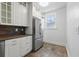 Bright kitchen with stainless steel refrigerator and ample cabinet space at 2710 8Th N Ave, St Petersburg, FL 33713