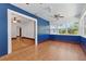 Bright and sunny sun room with a blue accent wall, neutral tiling, and multiple large windows at 2710 8Th N Ave, St Petersburg, FL 33713