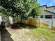 Backyard featuring an air conditioning unit and a white fence providing privacy at 2731 Hampton Green Ln, Brandon, FL 33511