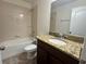 Full bathroom with granite countertop vanity, tile floors and shower-tub combo at 2731 Hampton Green Ln, Brandon, FL 33511