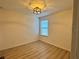 Bright bedroom with hardwood floors and contemporary ceiling fan at 2731 Hampton Green Ln, Brandon, FL 33511