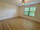 Bright bedroom with hardwood floors and large window at 2731 Hampton Green Ln, Brandon, FL 33511