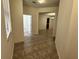 Open entryway featuring neutral colored tile flooring at 2731 Hampton Green Ln, Brandon, FL 33511