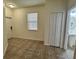 Open entryway featuring neutral colored tile flooring and a half bathroom at 2731 Hampton Green Ln, Brandon, FL 33511