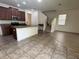 Open kitchen layout with bar seating and tile flooring at 2731 Hampton Green Ln, Brandon, FL 33511