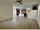 Spacious living room flows to kitchen with stainless steel appliances, and center island at 2731 Hampton Green Ln, Brandon, FL 33511