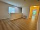 Open-concept living space with hardwood floors and neutral paint at 2731 Hampton Green Ln, Brandon, FL 33511