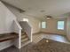 Spacious living room with hardwood floors, staircase and plenty of natural light at 2731 Hampton Green Ln, Brandon, FL 33511