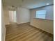 Bright and airy loft area with hardwood floors and natural light from the window at 2731 Hampton Green Ln, Brandon, FL 33511