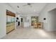 Eat-in kitchen featuring updated appliances, tile floor, breakfast bar, and dining area with outdoor access at 280 Fortaleza St, Punta Gorda, FL 33983