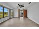 Bright living room features neutral paint, a ceiling fan, and views of the pool at 280 Fortaleza St, Punta Gorda, FL 33983