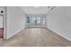 Bright living room with tile flooring, large windows offering natural light, and a neutral color palette at 280 Fortaleza St, Punta Gorda, FL 33983
