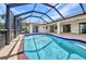 Wide angle view of a private pool and lanai surrounded by a screen enclosure at 280 Fortaleza St, Punta Gorda, FL 33983