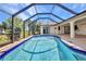Inviting pool and lanai are caged in, offering privacy and enjoyment for sunny days at 280 Fortaleza St, Punta Gorda, FL 33983