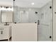 Beautiful bathroom features a glass enclosed shower with marble tiling and modern fixtures at 28516 Tranquil Lake Cir, Wesley Chapel, FL 33543