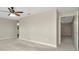 Neutral bedroom features plush carpet, neutral walls, and open door to en-suite bathroom at 28516 Tranquil Lake Cir, Wesley Chapel, FL 33543