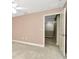 Neutral bedroom boasts plush carpet, a neutral walls, and open door at 28516 Tranquil Lake Cir, Wesley Chapel, FL 33543