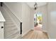 Inviting entryway with a view of the front yard and staircase at 28516 Tranquil Lake Cir, Wesley Chapel, FL 33543