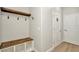 Functional mudroom with bench seating, storage cubbies, and coat hooks at 28516 Tranquil Lake Cir, Wesley Chapel, FL 33543