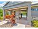 Community pool house entrance with gated access to pool and lush landscaping at 28516 Tranquil Lake Cir, Wesley Chapel, FL 33543