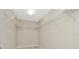 Walk-in closet with installed wire shelving for optimal storage space at 28516 Tranquil Lake Cir, Wesley Chapel, FL 33543